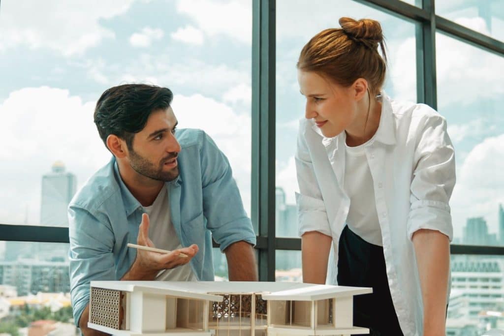 https://www.freepik.com/premium-photo/skilled-architect-team-discussion-about-house-model-construction-tracery_157438591.htm#fromView=search&page=1&position=16&uuid=ded662a9-68bf-4e52-a909-bade1c10cefb&query=Architecture+Companies+in+Chennai%3A+How+to+Choose+the+Right+Firm+for+Your+Home+or+Commercial+Project